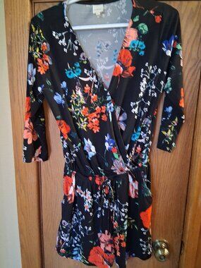 Gorgeous size womens small floral romper. 3/4 sleeve, flattering fabric